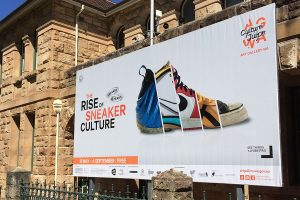 Very eye-catching sneaker exhibition billboard sign for the Art Gallery of WA printed, finished and installed by Imagesource