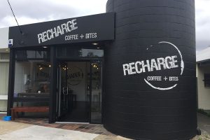Imagesource floor graphics and wall graphics are designed for adhering to concrete, asphalt, tiles and brick walls, just like this example pictured for Recharge Coffee + Bites