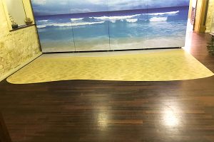 Floor graphic and wall graphic signage of a beach scene for a the WA Museum of Perth