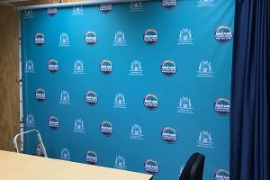 Imagesource can print to fabric and mount to framework for custom made media backdrops such as this one for the Government of WA