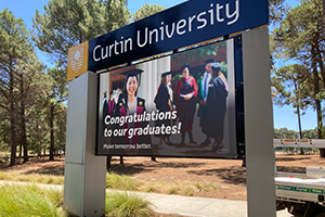 Imagesource print to PVC banner vinyl, and finished with a keder edge and mount on sail track for this billboard signage for Curtin University