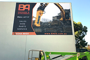 This vinyl banner for BAEG and Epiroc is mounted using our keder edge and sail track system