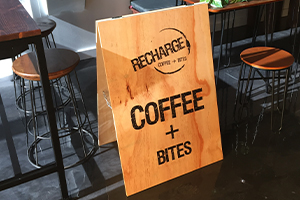 Custom A frame sign printed direct onto wood and finished by Imagesource Perth for Recharge Coffee + Bites in Burswood