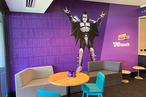 Creative wall graphics featuring Gene Simmons from Kiss at Optus Stadium TAB Room