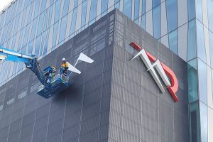 The Imagesource signage install team up in the air installing the sky illuminated sign for Mineral Resources in Osborne Park Perth