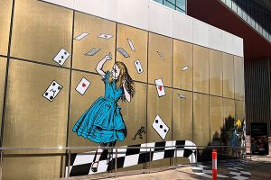A close up of Alice from the Alice in Wonderland themed window graphics and floor graphics for the latest museum exhibition printed and installed by Imagesource Perth