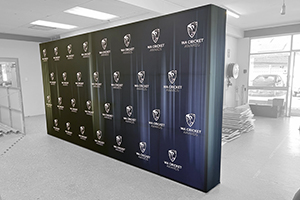 Imagesource achieved this ultra-long media wall by joining two pop-up walls and skinning with one giant fabric skin that we printed and finished in-house