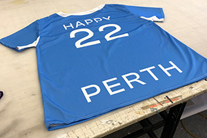 The Visit Perth Quokka mascot shirt for Tourism WA on the bench in the finishing room
